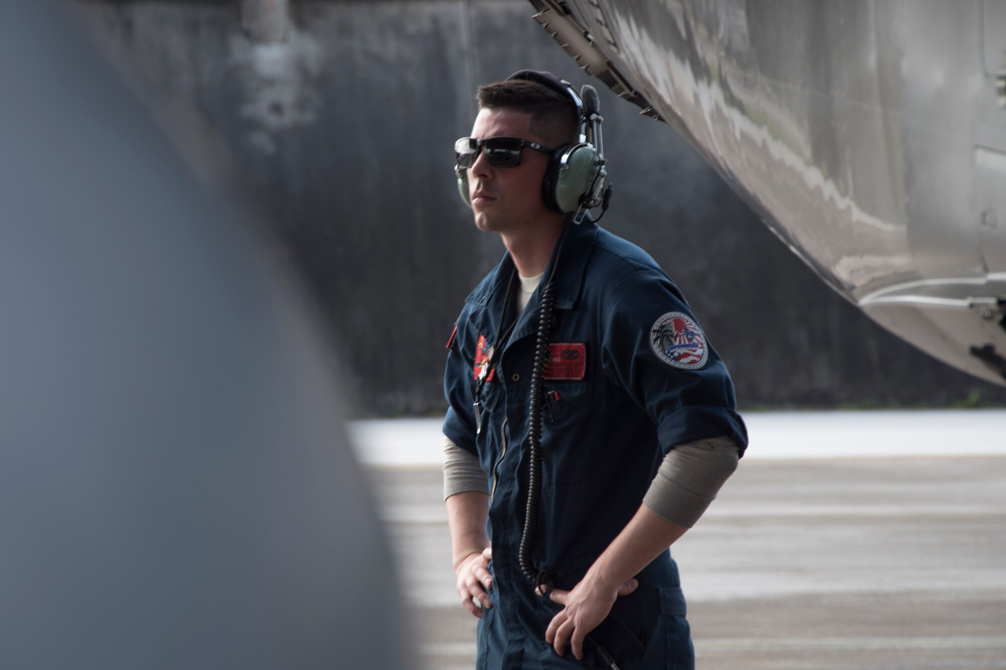 U.S. Air Force Senior Airman Maxwell Seley, 67th Aircraft Maintenance Unit crew chief, waits for an F-15 Eagle pilot to start an aircraft’s engine during annual exercise Cope North Feb. 20, 2017, at Andersen Air Force Base, Guam. Maintenance Airmen keep aircraft running safely and effectively which enables Pacific Air Force units, such as the 67th FS, to provide protection and stability throughout the Indo-Asia Pacific. (U.S. Air Force photo by Senior Airman John Linzmeier/released)