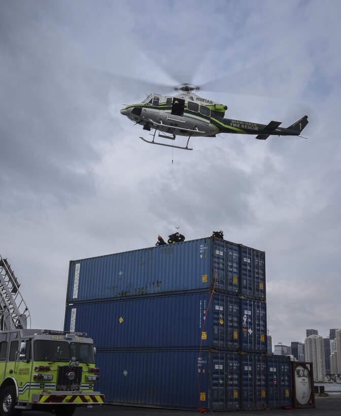 Firefighters with the Miami-Dade Fire Rescue Department response to a scenario at a joint hazard material exercise at the Port of Miami, Feb. 18, 2017.  The Defense Chemical, Biological, Radiological, and Nuclear Response Force exercise hosted by MDFR and the Miami-Dade Port Authority encompassed the U.S. Army Reserve 329th Chemical Company, the Army Reserve’s 469th Ground Ambulance Company, from Wichita, Kan., and the Florida National Guard’s Civil Support Team. (U.S. Army Reserve photo by Master Sgt. Marisol Walker/Released)