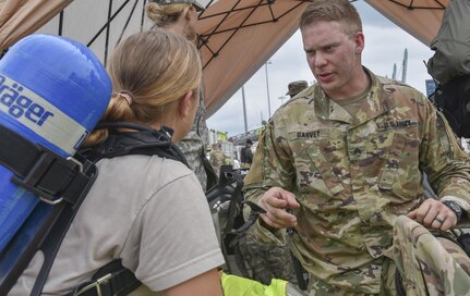 U.S. Army Reserve Sgt. Ryan A. Garvey, a Chemical, Biological, Radiological, and Nuclear specialist with the 329th Chemical Company based in Orlando, Fla., prepares his Soldiers for a chemical task in a joint hazard material exercise with the U.S. Army and the Miami-Dade Fire Rescue Department at the Port of Miami, Feb. 18, 2017.  The 329th Chemical, Biological, Radiological, and Nuclear (CBRN) Company (Reconnaissance and Surveillance), from Orlando, Fla., the Army Reserve’s 469th Ground Ambulance Company, from Wichita, Kan., and the Florida National Guard’s Civil Support Team, spent the day training with MDFR firefighters during a sustainment training exercise that combines civil authorities and Defense CBRN Response Force, in Miami, Florida. (U.S. Army Reserve photo by Master Sgt. Marisol Walker/Released)