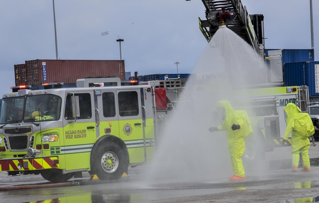 U.S. Army Reserve Soldiers from the 329th Chemical Company, rinse off after conducting a joint hazard material exercise with the U.S. Army and the Miami-Dade Fire Rescue Department at the Port of Miami, Feb. 18, 2017.  The 329th Chemical, Biological, Radiological, and Nuclear (CBRN) Company (Reconnaissance and Surveillance), from Orlando, Fla., the Army Reserve’s 469th Ground Ambulance Company, from Wichita, Kan., and the Florida National Guard’s Civil Support Team, spent the day training with MDFR firefighters during a sustainment training exercise that combines civil authorities and Defense CBRN Response Force, in Miami, Florida. (U.S. Army Reserve photo by Master Sgt. Marisol Walker/Released)
