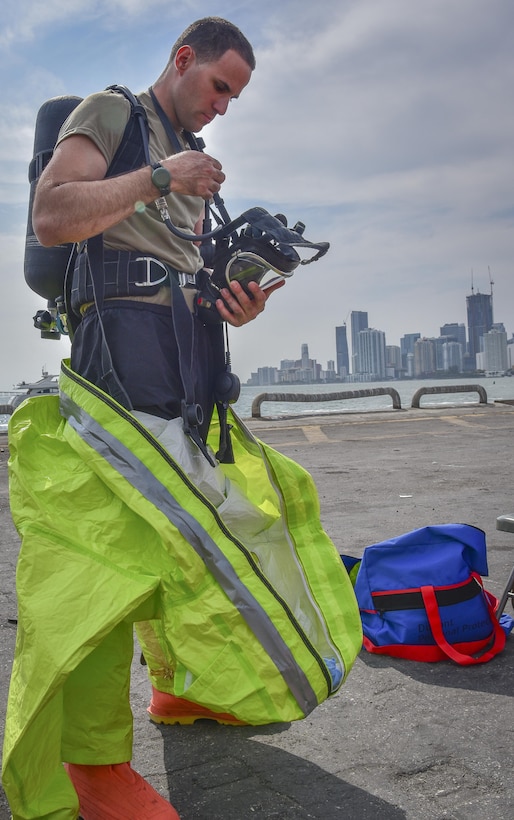 A U.S. Army Reserve Soldier with the 329th Chemical Company based in Orlando, Fla., inspects his self-contained breathing apparatus (SCBA) in preparation for a joint hazard material exercise with the U.S. Army and the Miami-Dade Fire Rescue Department at the Port of Miami, Feb. 18, 2017.  The 329th Chemical, Biological, Radiological, and Nuclear (CBRN) Company (Reconnaissance and Surveillance), from Orlando, Fla., the Army Reserve’s 469th Ground Ambulance Company, from Wichita, Kan., and the Florida National Guard’s Civil Support Team, spent the day training with MDFR firefighters during a sustainment training exercise that combines civil authorities and Defense CBRN Response Force, in Miami, Florida. (U.S. Army Reserve photo by Master Sgt. Marisol Walker/Released)
