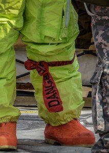 A U.S. Army Reserve Soldier with the 329th Chemical Company based in Orlando, Fla., prepares to move through the decontamination line after conducting a joint hazard material exercise with the U.S. Army and the Miami-Dade Fire Rescue Department at the Port of Miami, Feb. 18, 2017.  The 329th Chemical, Biological, Radiological, and Nuclear (CBRN) Company (Reconnaissance and Surveillance), from Orlando, Fla., the Army Reserve’s 469th Ground Ambulance Company, from Wichita, Kan., and the Florida National Guard’s Civil Support Team, spent the day training with MDFR firefighters during a sustainment training exercise that combines civil authorities and Defense CBRN Response Force, in Miami, Florida. (U.S. Army Reserve photo by Master Sgt. Marisol Walker/Released)