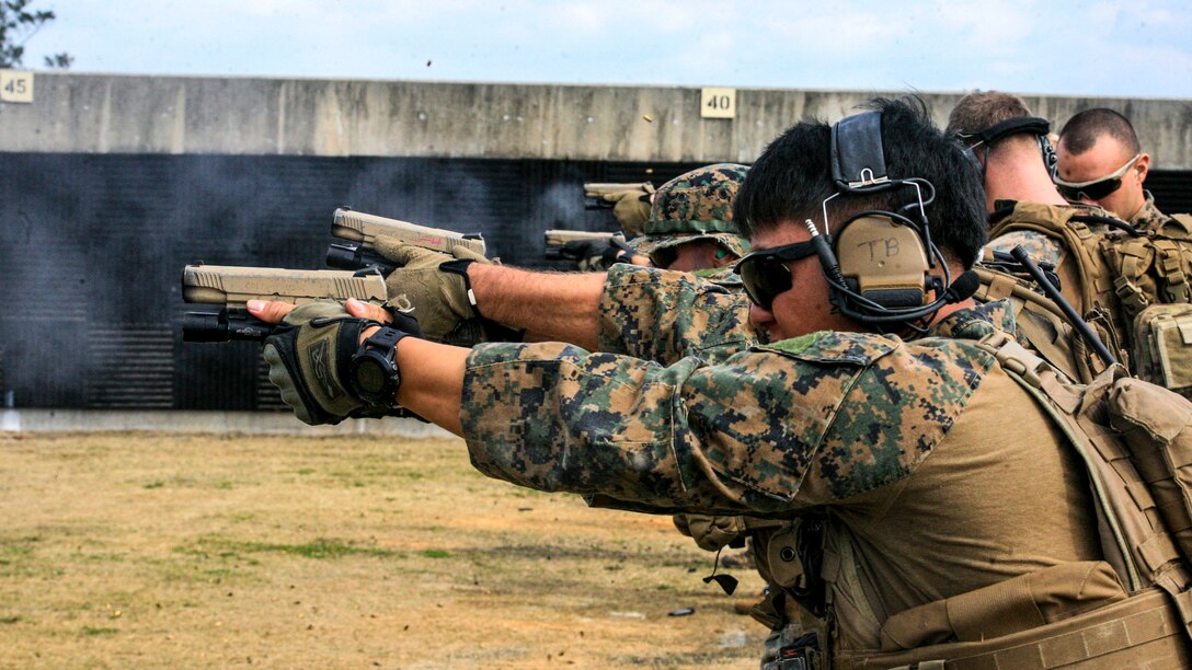 Marines fire M45A1 pistols during marksmanship training and qualification at Camp Hansen, Okinawa, Japan, Feb.16, 2017. Marine Corps photo by Lance Cpl. Jorge A. Rosales
