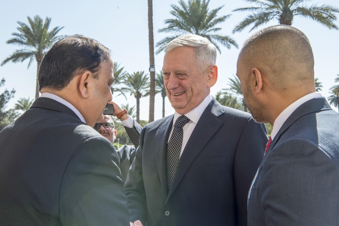 Defense Secretary Jim Mattis, center, shakes hands with Iraqi Minister of Defense Arfan al-Hayali at the Ministry of Defense in Baghdad, Iraq, Feb. 20, 2017. DoD photo by Air Force Tech. Sgt. Brigitte N. Brantley