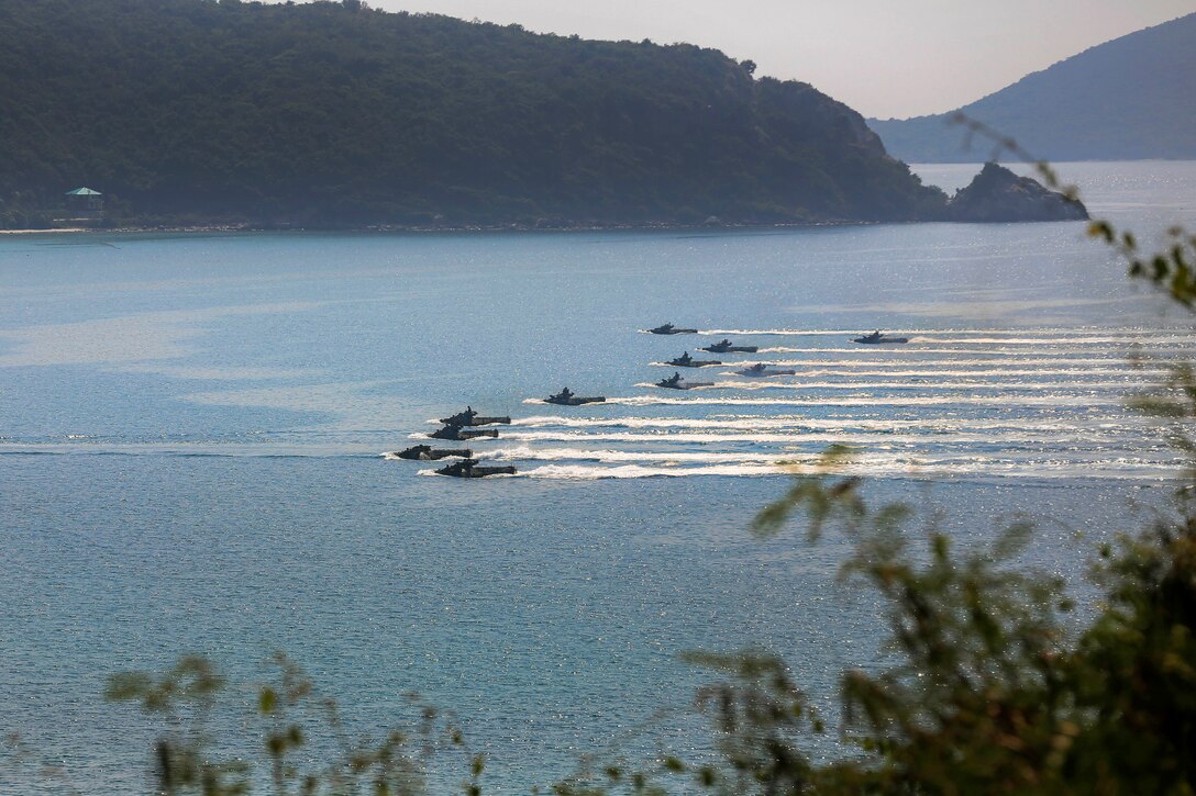 Amphibious assault vehicles carrying U.S., South Korean and Thai troops head for shore during Exercise Cobra Gold at Hat Yao, Rayong province, Thailand, Feb. 17, 2017. Marine Corps photo by Cpl. Wesley Timm