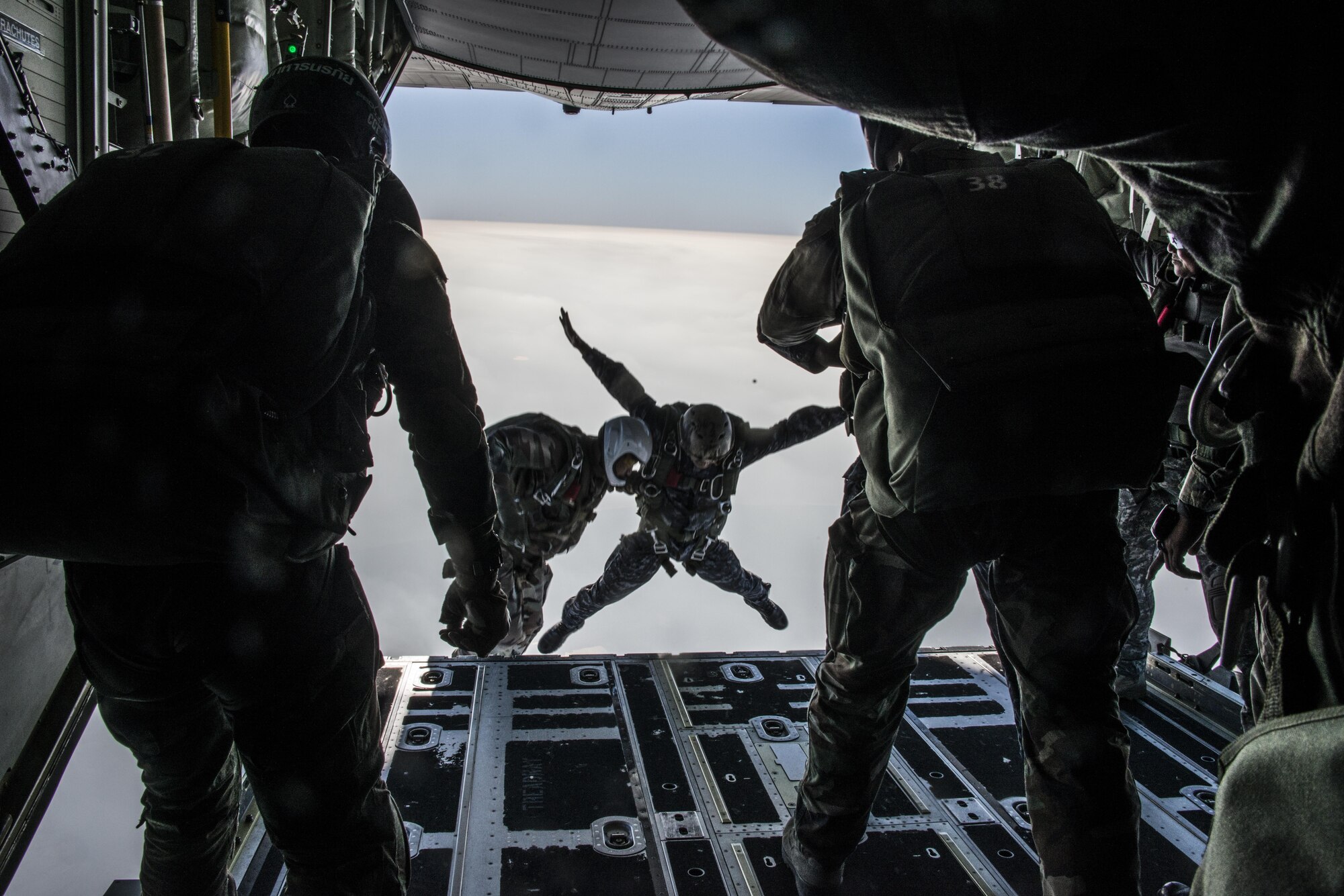 Royal Thai Air Force Special Operations Regiment combat controllers and pararescuemen jump from an MC-130J Commando II assigned to the 17th Special Operations Squadron, Feb. 14, 2017 at Chandy Range, Thailand. Executing jump operations throughout Cobra Gold 2017, the members of the 320th Special Tactics Squadron and Royal Thai Air Force Special Operations Regiment demonstrate the strength of a partnership that has evolved over the last 17 years. (U.S. Air Force photo by Capt. Jessica Tait)