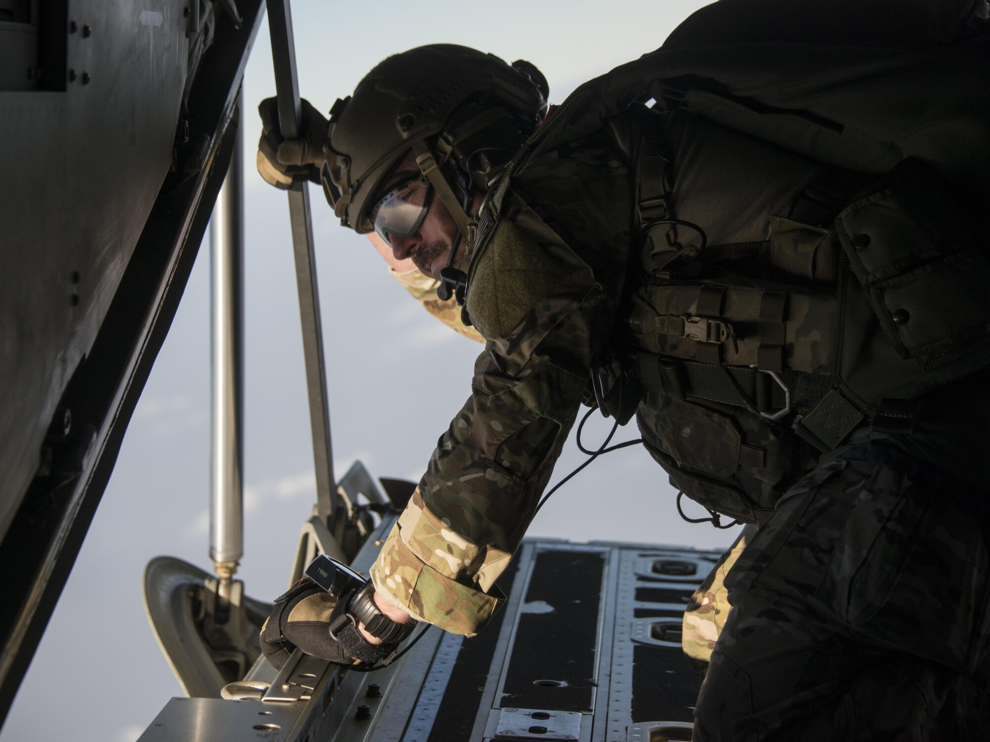 U.S. Air Force Master Sgt. David Ibson, 320th Special Tactics Squadron jump master, looks out the back of an MC-130J Commando II assigned to the 17th Special Operations Squadron, Feb. 14, 2017 at Chandy Range, Thailand. Executing jump operations throughout Cobra Gold 2017, the members of the 320th STS and Royal Thai Air Force Special Operations Regiment demonstrate the strength of a partnership that has evolved over the last 17 years. (U.S. Air Force photo by Capt. Jessica Tait)