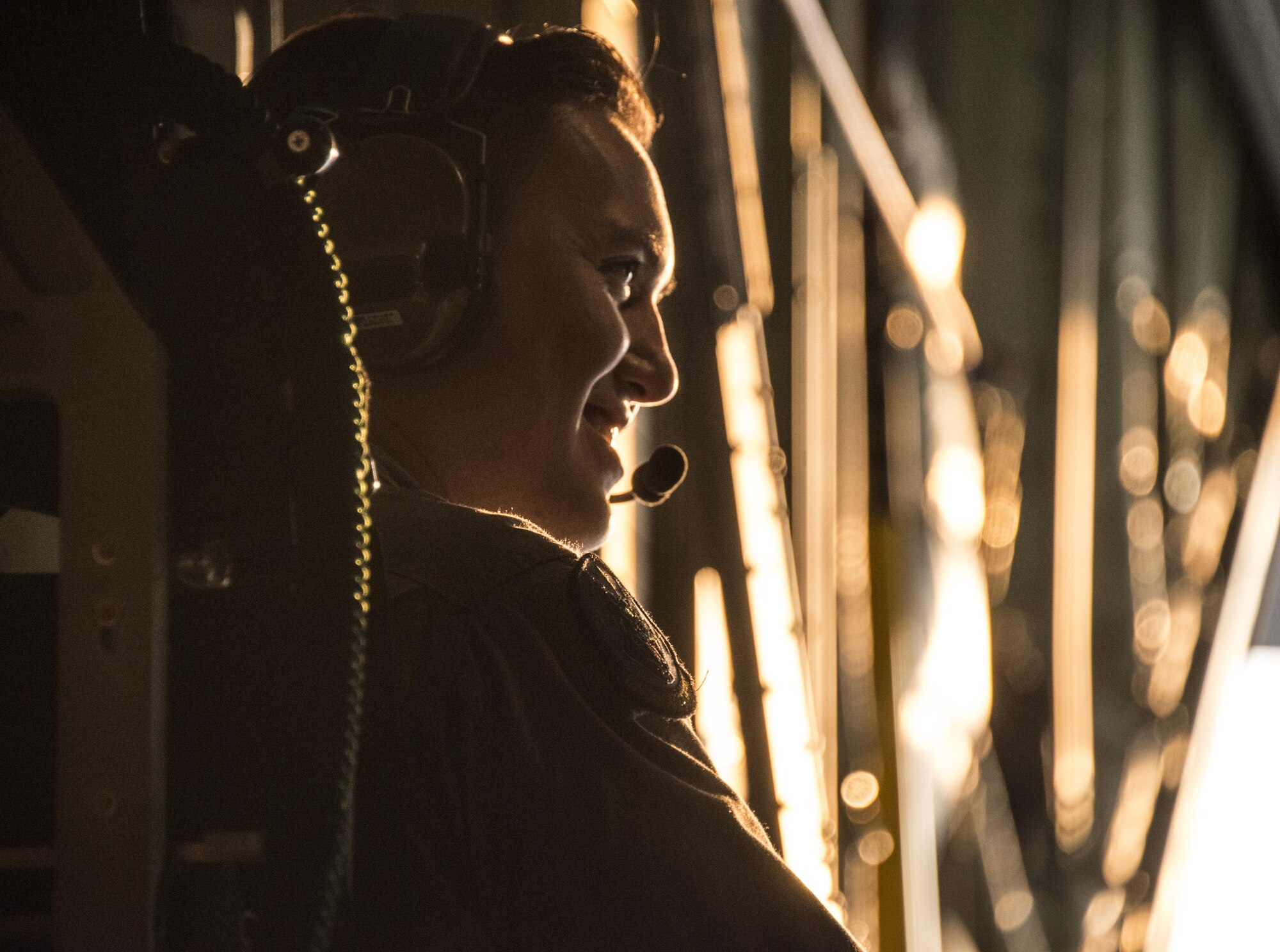 U.S. Air Force Senior Airman Christopher Linnbaum, 17th Special Operations Squadron loadmaster, sits in the back of an MC-130J Commando II following the successful completion of bilateral jump operations, Feb. 14, 2017 at Korat Air Base, Thailand. Executing jump operations throughout Cobra Gold 2017, the members of the 320th Special Tactics Squadron and Royal Thai Air Force Special Operations Regiment demonstrate the strength of a partnership that has evolved over the last 17 years. (U.S. Air Force photo by Capt. Jessica Tait)
