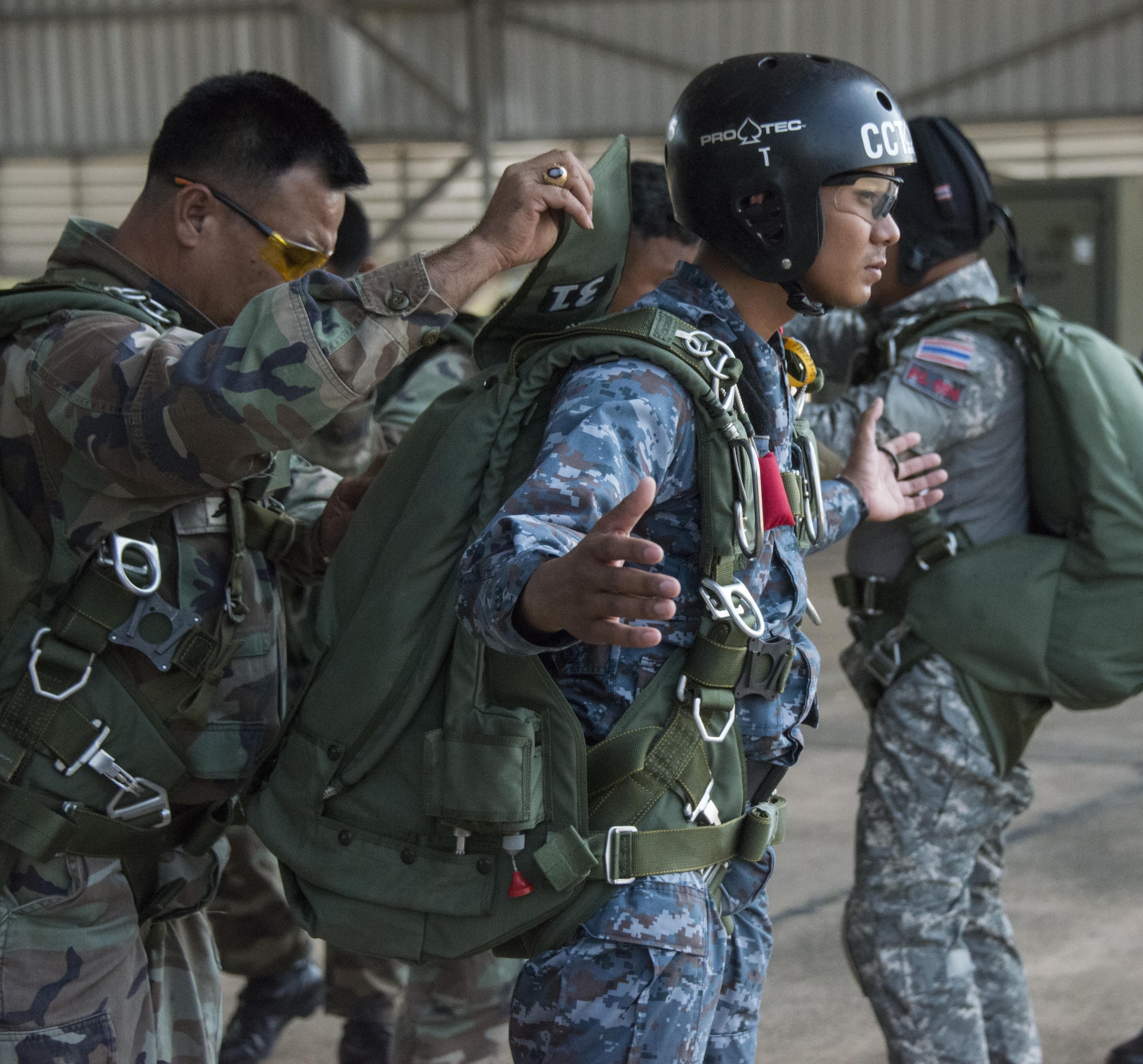 Royal Thai Air Force Special Operations Regiment combat controllers and pararescuemen prepare for bilateral jump operations from a U.S. Air Force MC-130J Commando II assigned to the 17th Special Operations Squadron, Feb. 14, 2017 at Korat Air Base. Throughout Cobra Gold 2017, the 320th Special Tactics Squadron and RTAF SOR combat controllers and pararescuemen trained side-by-side. (U.S. Air Force photo by Capt. Jessica Tait)