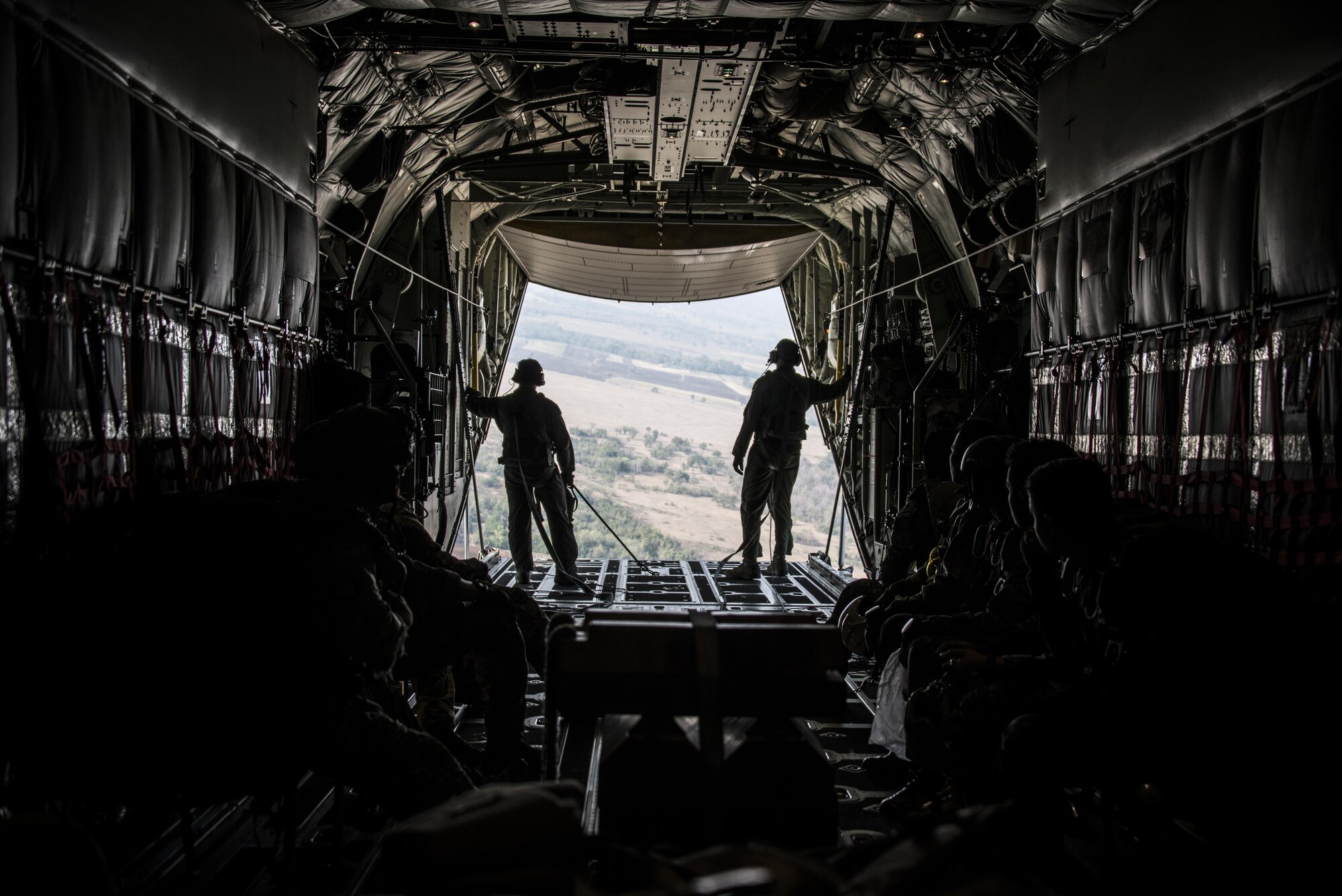 U.S. Air Force loadmasters assigned to the 17th Special Operations Squadron open up the back of an MC-130J Commando II in preparation for jump operations, Feb. 14, 2017 at Chandy Range, Thailand. Throughout Cobra Gold 2017, the 17th SOS provided specialized aviation to members of the 320th Special Tactics Squadron and Royal Thai Air Force Special Operations Regiment. (U.S. Air Force photo by Capt. Jessica Tait)