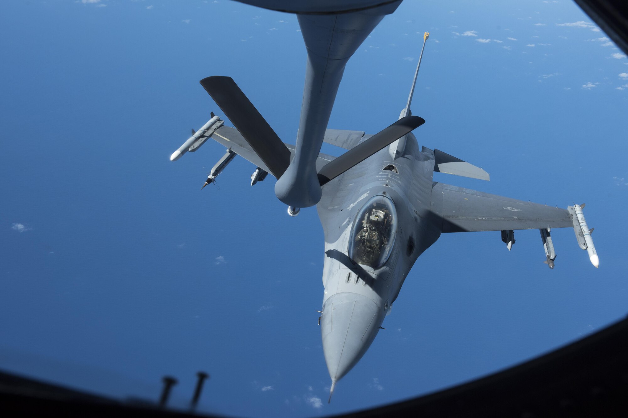 A U.S. Air Force F-16 Fighting Falcon assigned to the 14th Fighter Squadron from Misawa Air Base, Japan, receives fuel from a KC-135 Stratotanker during Cope North, Feb. 21, 2017. Cope North is an annual exercise which enables regional forces to hone vital readiness skills. Through air refueling operations, U.S. Air Force and allied aircraft have the capability to deter threats and promote security across the Indo-Asia Pacific region. (U.S. Air Force photo by Senior Airman John Linzmeier/released)