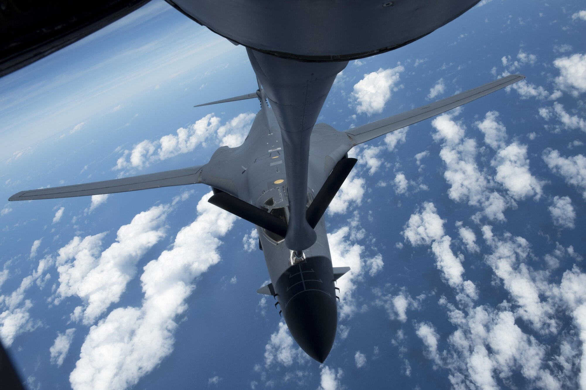 A U.S. Air Force B-1B Lancer assigned to the 9th Expeditionary Bomb Squadron receives fuel from a KC-135 Stratotanker from the 909th Air Refueling Squadron during annual exercise Cope North, Feb. 21, 2017.  Cope North provides an opportunity to train and increase combat readiness and interoperability between partnered forces. Stratotankers have provided the core aerial refueling capability for the United States Air Force for more than 60 years. (U.S. Air Force photo by Senior Airman John Linzmeier/released)