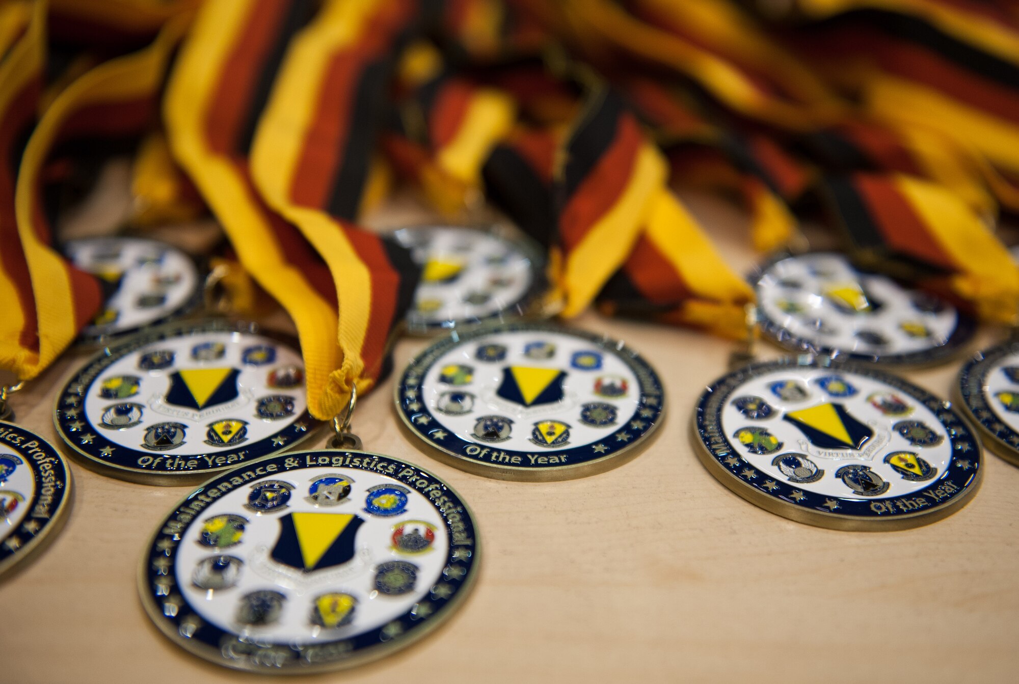 Medallions are arranged on a table at the 2016 Maintenance and Logistics Airmen Annual Award ceremony on Ramstein Air Base, Germany, Feb. 17, 2017. Airmen from the maintenance and logistics career fields were brought together to send off 2016 with an annual award ceremony that recognized the very best amongst them. (U.S. Air Force photo by Senior Airman Lane T. Plummer)