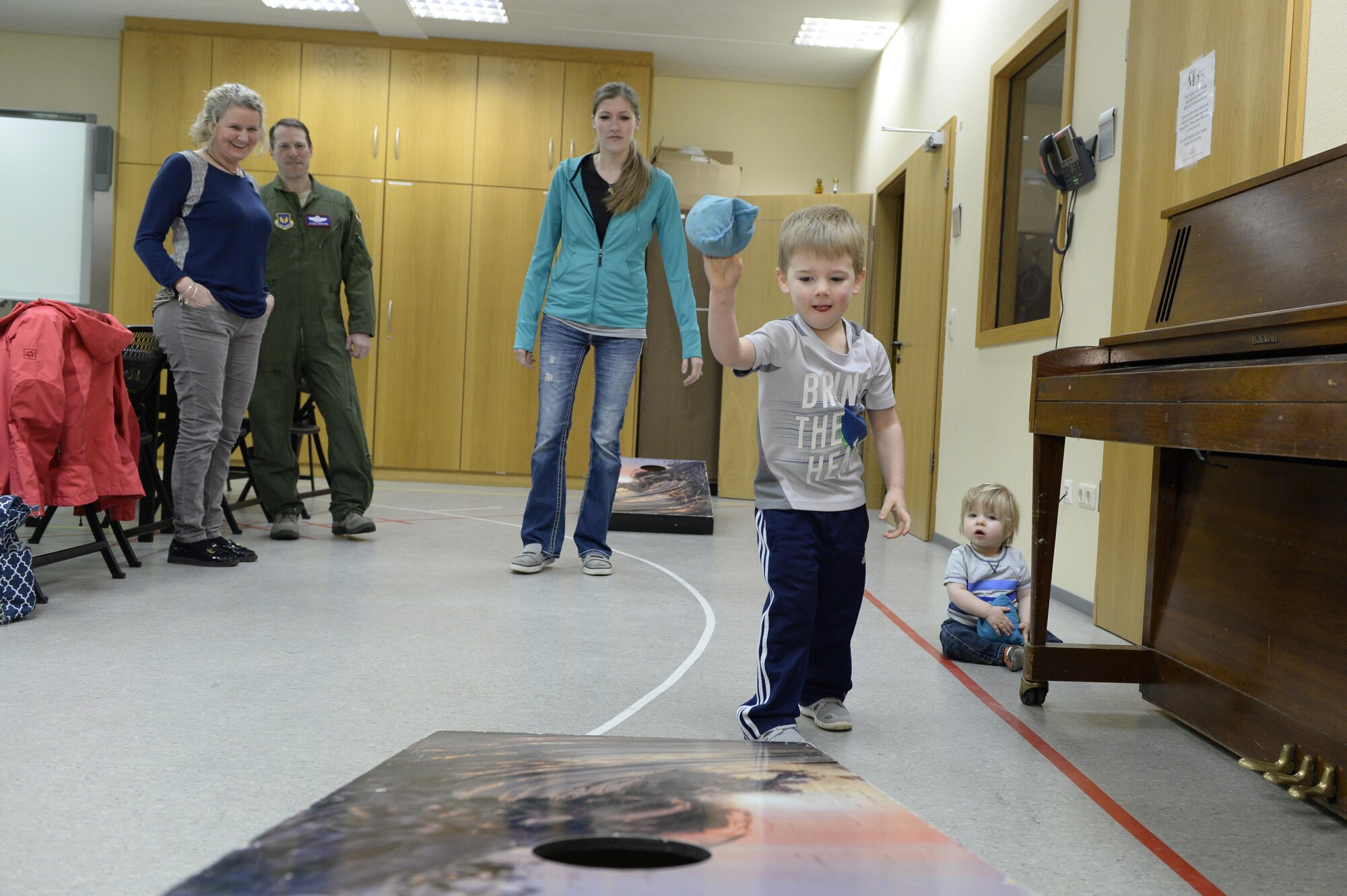 Braxton Wolthuizen, son of deployed Maj. Justin Wolthuizen, plays games during a chili cook-off sponsored by the First Sergeants Association for deployed family night at Spangdahlem Air Base, Germany, Feb. 16, 2017. The Airman and Family Readiness Center holds a deployed family night monthly and different agencies and squadrons take turns sponsoring. (U.S. Air Force photo by Tech. Sgt. Staci Miller)