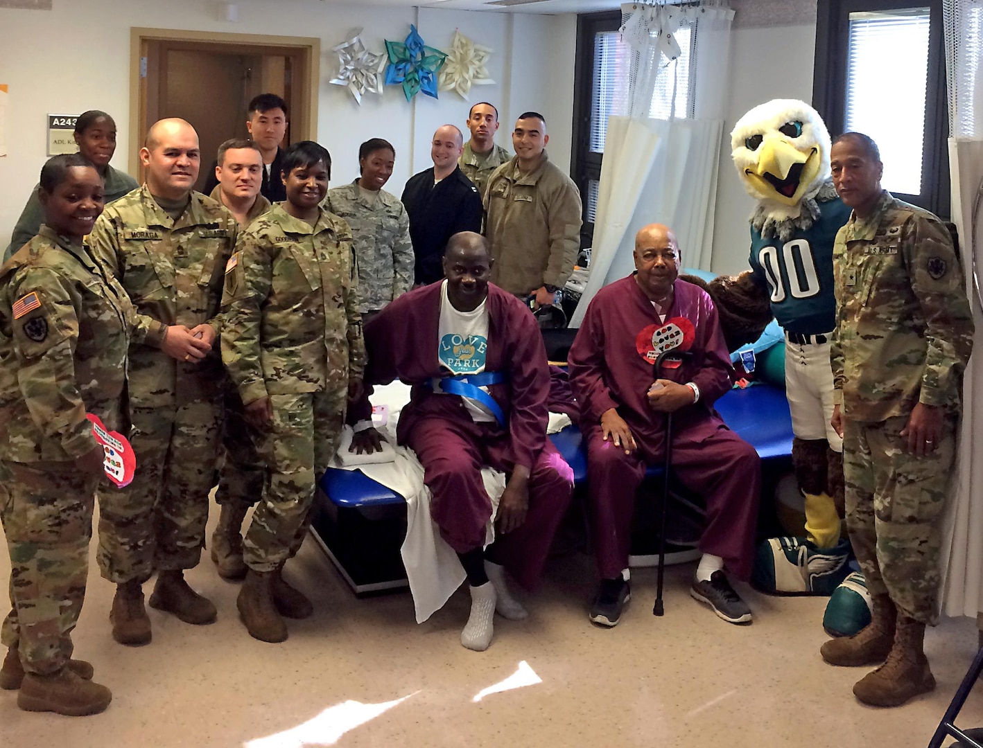 Soldiers, sailors and airmen assigned to DLA Troop Support posed for a picture with the Philadelphia Eagles’ mascot “Swoop” and two veteran patients at the Michael J. Crescenz Veteran Medical Center in Philadelphia Feb. 17 as part of the 40th annual National Salute to Veterans Patient Week.