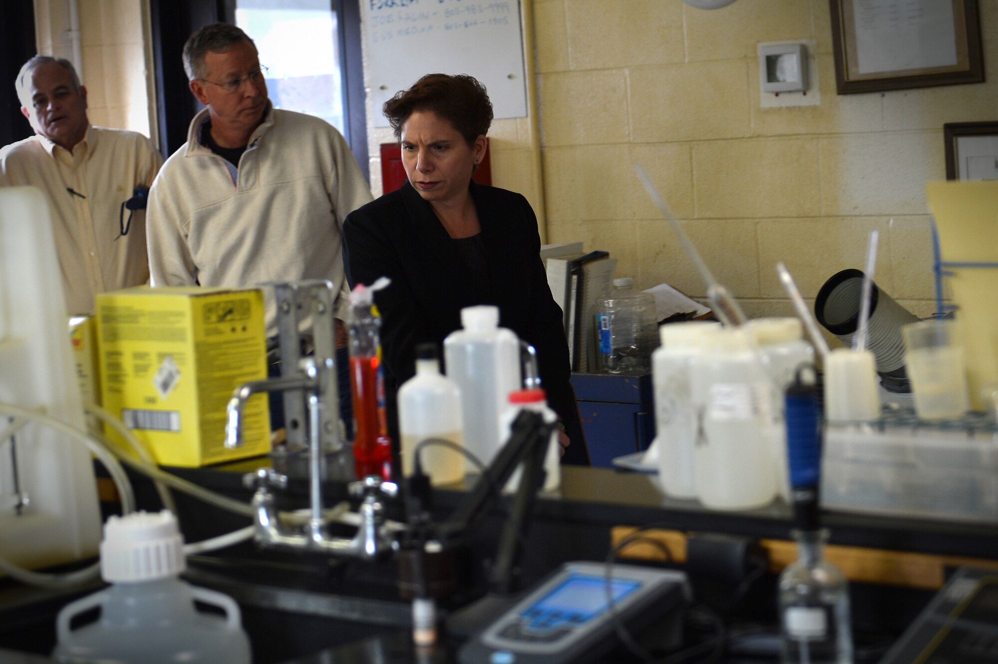 Candler Mathews, 20th Civil Engineer Squadron water program manager, left, Nick Muszynski, 20th CES civil engineer infrastructure and environmental flight chief, center, and Jane Allen, 20th Mission Support Group director of installations, right, receive a tour of the 20th Civil Engineer Squadron water treatment laboratory at Shaw Air Force Base, S.C., Feb. 15, 2017. Team Shaw members assigned to the 20th CES water treatment laboratory are tasked with examining incoming water for debris and performing tests to ensure water is purified. (U.S. Air Force photo by Airman 1st Class Christopher Maldonado)