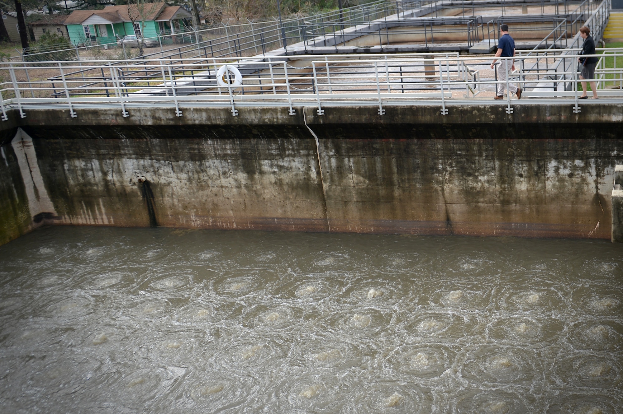 Jane Allen, 20th Mission Support Group director for installations, right, and Tony Quercia, National Operations and Mechanical Inc. contract and water treatment facility manager, left, discuss the functions of the water treatment facility at Shaw Air Force Base, S.C., Feb. 15, 2017. The treatment facility funneled over 450,000 gallons of water each day during January, providing potable water for the base.  (U.S. Air Force photo by Airman 1st Class Christopher Maldonado)