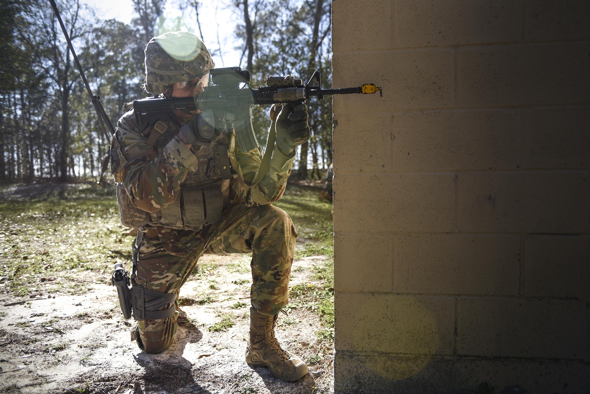 An Airman from the 822d Base Defense Squadron keeps watch for opposing forces during a Full Mission Profile exercise, Feb. 15, 2017, at Moody Air Force Base, Ga. The 822d BDS is completing training exercises that will gradually increase in difficulty each week to prepare for an upcoming Mission Readiness exercise. The FMP enhanced training by increasing the complications and dangers of scenarios that challenged Airmen on simulated patrols. The exercise also pushed leadership in the Tactical Operation Center to successfully guide the Airmen through the challenges. (U.S. Air Force photo by Airman 1st Class Janiqua P. Robinson)