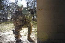 An Airman from the 822d Base Defense Squadron keeps watch for opposing forces during a Full Mission Profile exercise, Feb. 15, 2017, at Moody Air Force Base, Ga. The 822d BDS is completing training exercises that will gradually increase in difficulty each week to prepare for an upcoming Mission Readiness exercise. The FMP enhanced training by increasing the complications and dangers of scenarios that challenged Airmen on simulated patrols. The exercise also pushed leadership in the Tactical Operation Center to successfully guide the Airmen through the challenges. (U.S. Air Force photo by Airman 1st Class Janiqua P. Robinson)