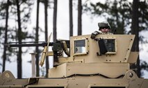Airman Kyle Regal, 822d Base Defense Squadron fireteam member, waits in the turret of a Mine Resistant-Ambush Protected Vehicle before going on a patrol during a Full Mission Profile exercise, Feb. 15, 2017, at Moody Air Force Base, Ga. The 822d BDS is completing training exercises that will gradually increase in difficulty each week to prepare for an upcoming Mission Readiness exercise. The FMP enhanced training by increasing the complications and dangers of scenarios that challenged Airmen on simulated patrols. The exercise also pushed leadership in the Tactical Operation Center to successfully guide the Airmen through the challenges. (U.S. Air Force photo by Airman 1st Class Janiqua P. Robinson)