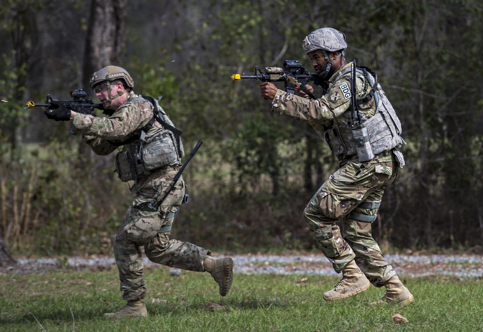 Airmen from the 822d Base Defense Squadron return fire at a simulated opposing force during a Full Mission Profile exercise, Feb. 15, 2017, at Moody Air Force Base, Ga. The 822d BDS is completing training exercises that will gradually increase in difficulty each week to prepare for an upcoming Mission Readiness exercise. The FMP enhanced training by increasing the complications and dangers of scenarios that challenged Airmen on simulated patrols. The exercise also pushed leadership in the Tactical Operation Center to successfully guide the Airmen through the challenges. (U.S. Air Force photo by Airman 1st Class Janiqua P. Robinson)