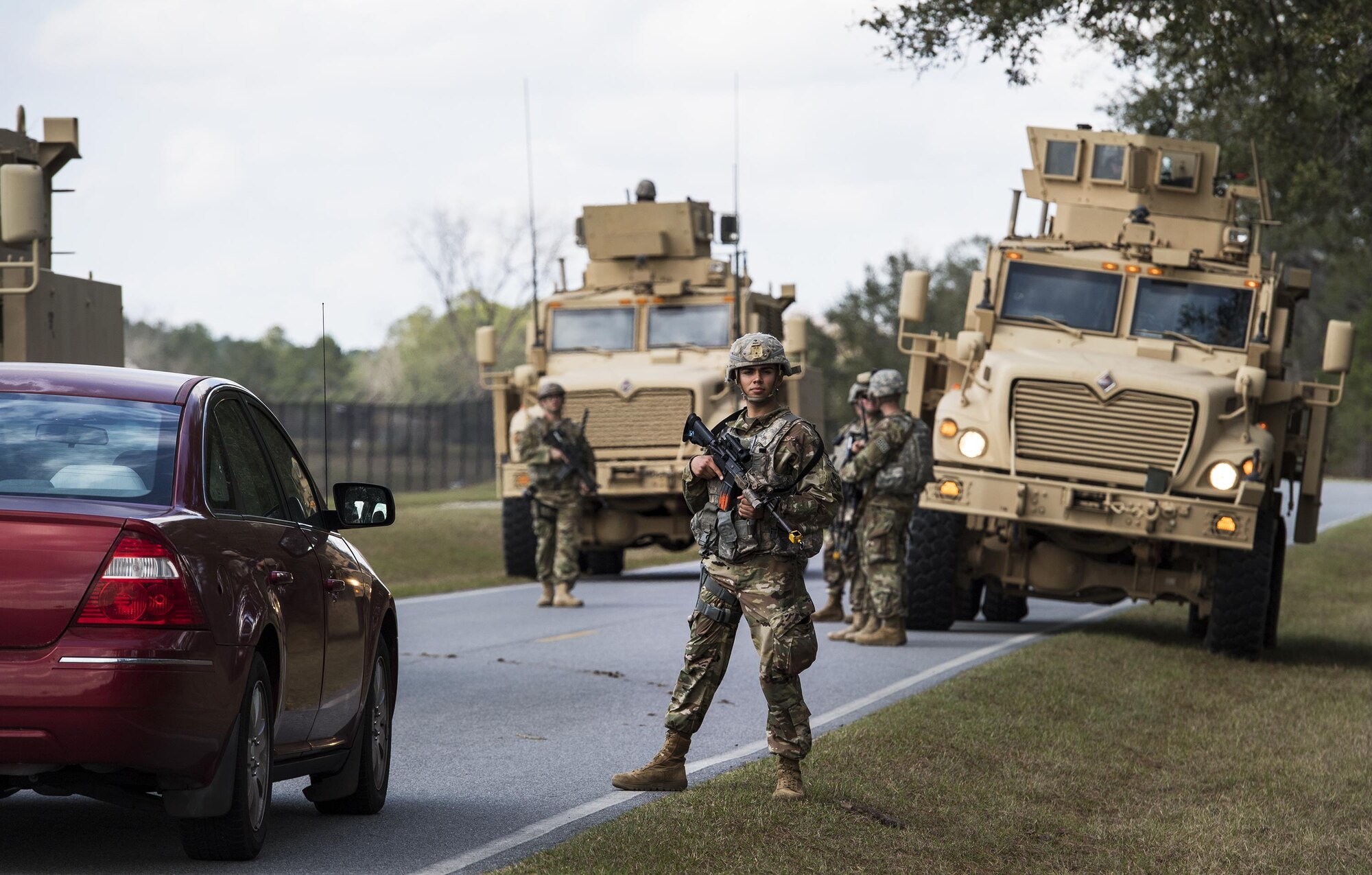 Airmen from the 822d Base Defense Squadron check cars for weapons during a Full Mission Profile exercise, Feb. 15, 2017, at Moody Air Force Base, Ga. The 822d BDS is completing training exercises that will gradually increase in difficulty each week to prepare for an upcoming Mission Readiness exercise. The FMP enhanced training by increasing the complications and dangers of scenarios that challenged Airmen on simulated patrols. The exercise also pushed leadership in the Tactical Operation Center to successfully guide the Airmen through the challenges. (U.S. Air Force photo by Airman 1st Class Janiqua P. Robinson)