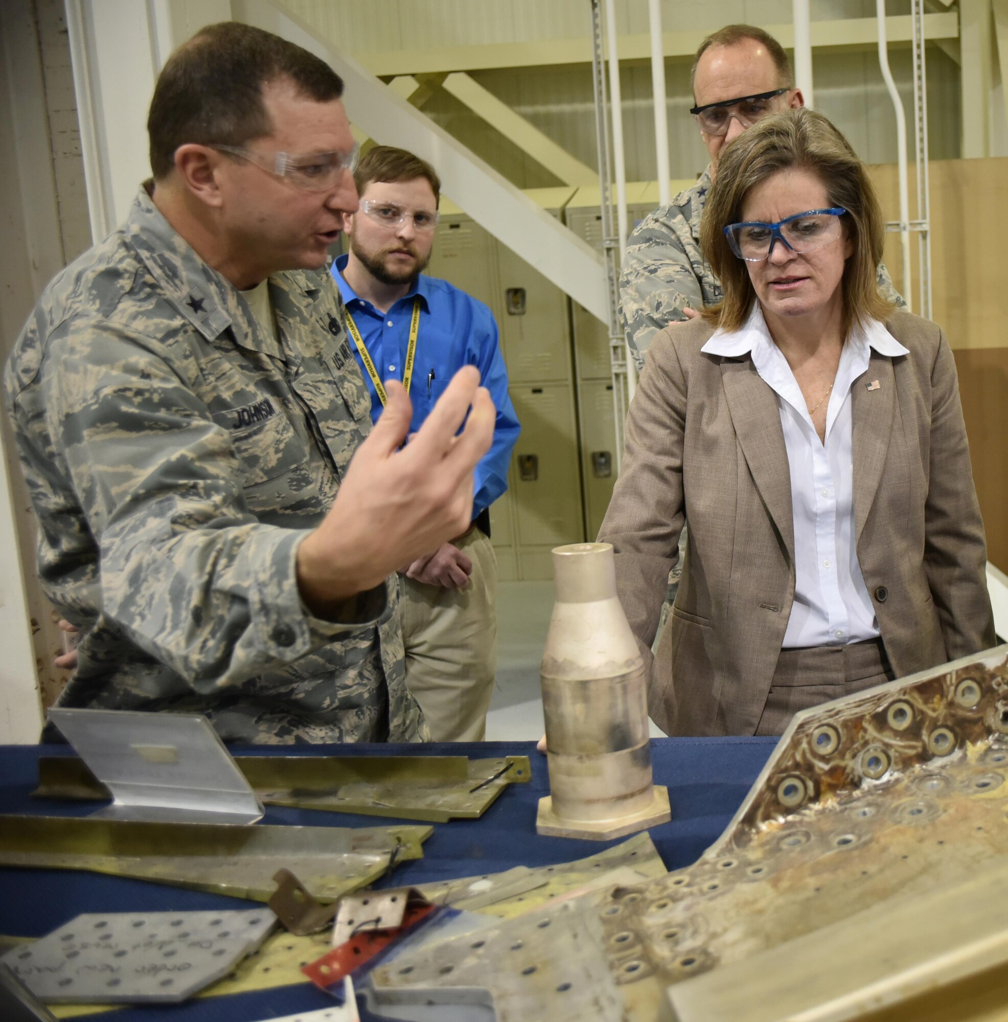 Brig. Gen. Mark Johnson, Oklahoma City Air Logistics Complex commander, discusses challenges associated with the programmed depot maintenance of the KC-135 Stratotanker with Kristin French, acting assistant secretary of defense (Logistics and Materiel Readiness), during Ms. French’s visit to Tinker Air Force Base Jan. 29-31. (Air Force photo by Darren D. Heusel)