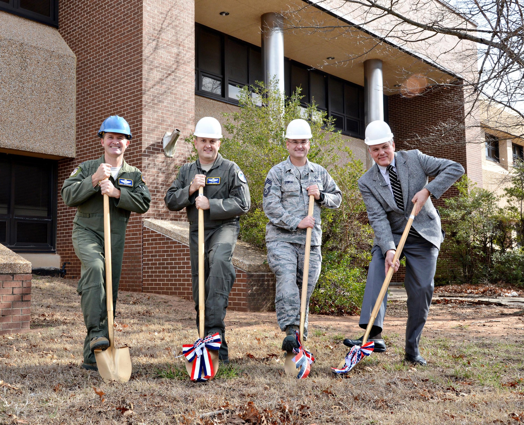 Air Force Flight Standards Agency’s senior leaders, from left, Col. Matthew Yetishefsky, AFFSA commander; Col. Todd Smith, AFFSA vice commander; Chief Master Sgt. Corey Bowen, AFFSA superintendent; and Ed Wright, AFFSA executive director, broke ground on the organization’s new residence Feb. 6. The more than 200 AFFSA members are currently housed at the Will Rogers Air National Guard Base and at the Mike Monroney Aeronautical Center campus, but after remodeling is finished in 2018, they will be relocated to a building at the Reserve Center on Douglas Blvd. (Air Force photo by Kelly White)