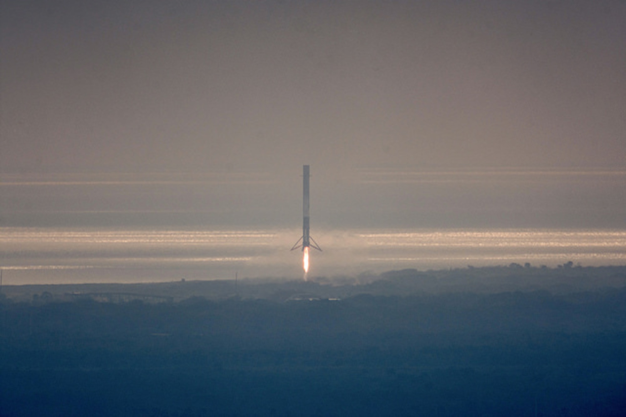 SpaceX Falcon 9's 1st stage booster on Space Launch Complex 13 after landing at Cape Canaveral Air Force Station Feb. 19, 2017. The booster landed minutes after the successful launch of the Falcon 9 carrying the 10th commercial resupply mission to the International Space Station. (Courtesy photo/SpaceX)