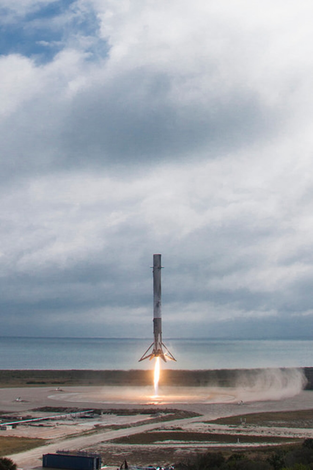 SpaceX Falcon 9's 1st stage booster on Space Launch Complex 13 after landing at Cape Canaveral Air Force Station Feb. 19, 2017. The booster landed minutes after the successful launch of the Falcon 9 carrying the 10th commercial resupply mission to the International Space Station. (Courtesy photo/SpaceX)
