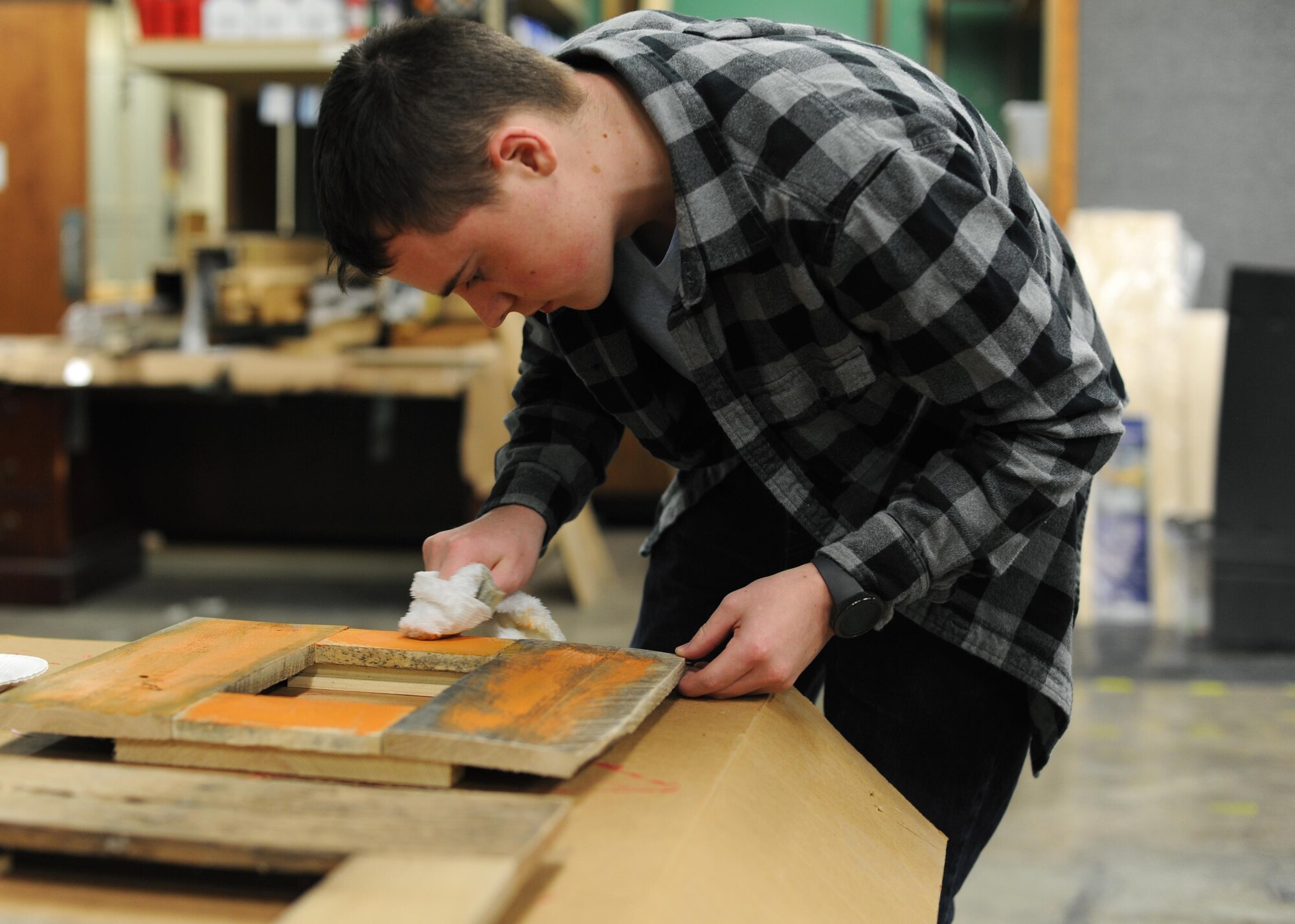 U.S. Air Force Airman 1st Class Alexander Ross, 19th Aircraft Maintenance Squadron Integrated Flight Control Systems apprentice, uses a rag to create an aged effect on a picture frame during a class Feb. 15, 2017, at the 19th Force Support Squadron Skills and Development Center Wood Frame Shop on Little Rock Air Force Base, Ark. The wood frame shop gives artists, hobbyists or beginners room to do more and take advantage of the equipment to create personal projects they may not be able to make in their home or dorm. (U.S. Air Force photo by Airman 1st Class Grace Nichols)