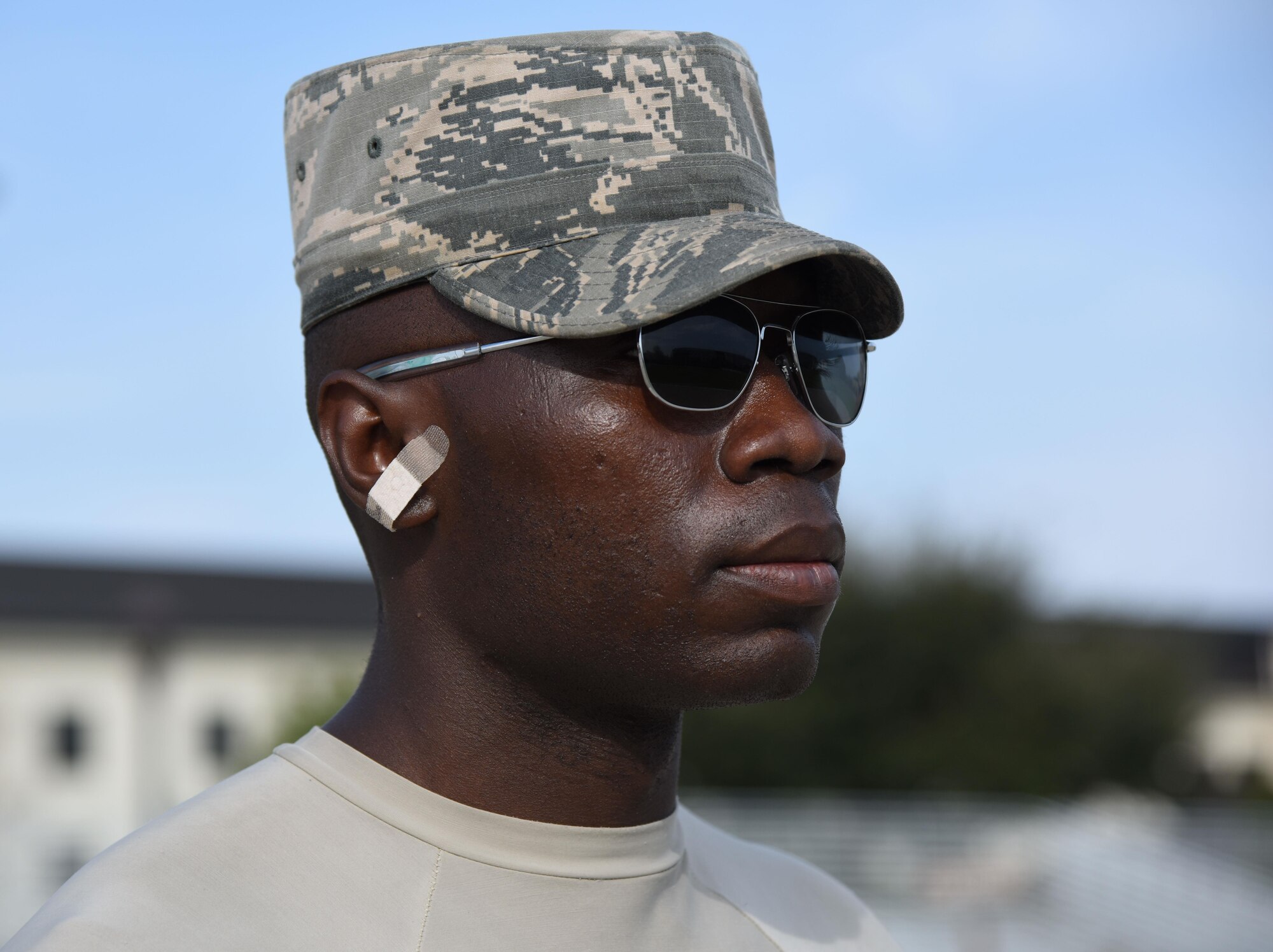 Airman 1st Class Coby Marshall, U.S. Air Force Honor Guard Drill Team member, wears a bandage on his ear to cover up an injury while practicing a new routine on the Levitow Training Support Facility drill pad Feb. 14, 2017, on Keesler Air Force Base, Miss. The team comes to Keesler every year for five weeks to develop a new routine, which is then revealed during an 81st Training Group drill down competition. The team preforms the routine used throughout the year. (U.S. Air Force photo by Kemberly Groue)