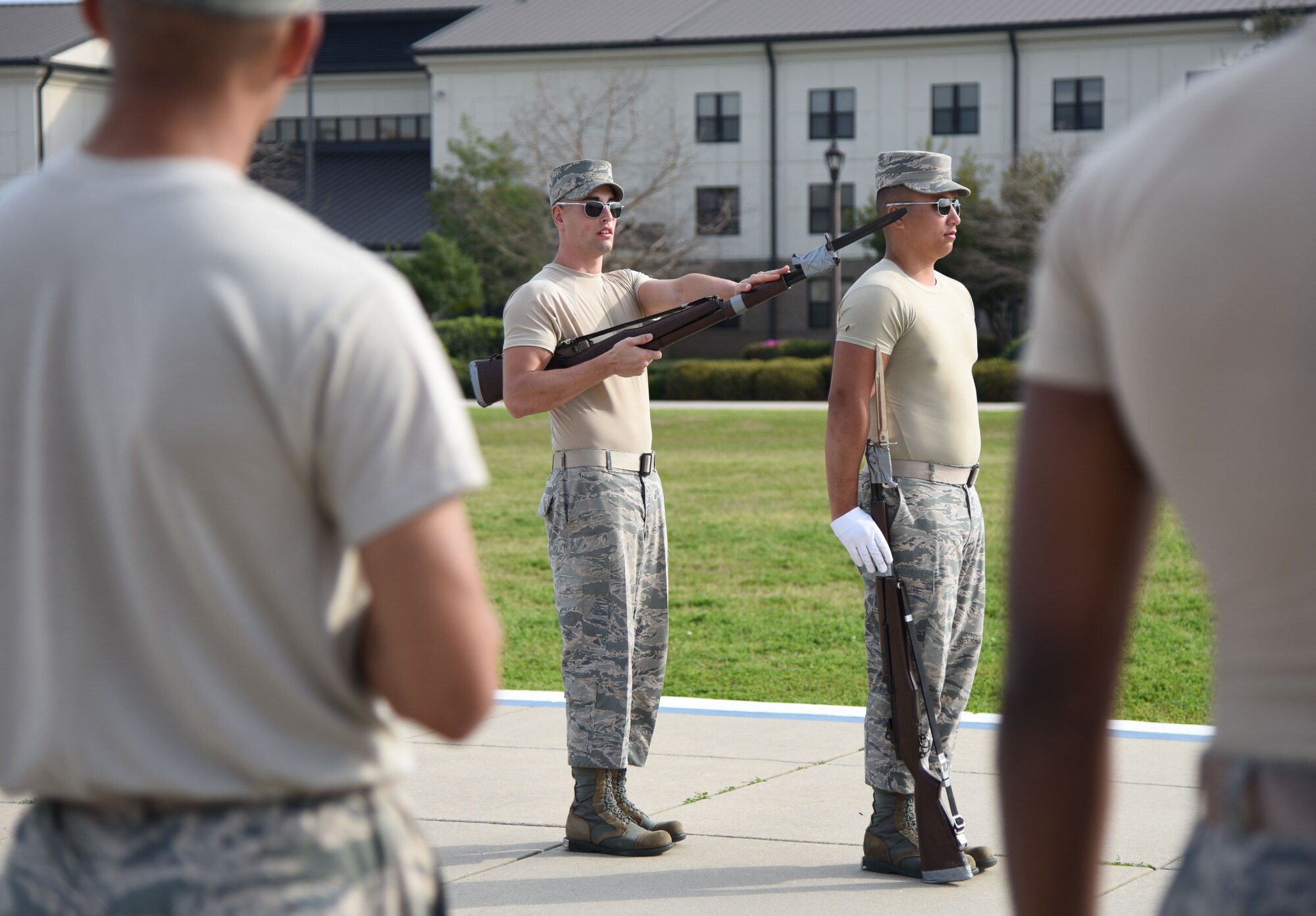 Senior Airman Larry Brown, U.S. Air Force Honor Guard Drill Team member, provides instruction during the practice of a new routine on the Levitow Training Support Facility drill pad Feb. 14, 2017, on Keesler Air Force Base, Miss. The team comes to Keesler every year for five weeks to develop a new routine, which is then revealed during an 81st Training Group drill down competition. The team preforms the routine used throughout the year. (U.S. Air Force photo by Kemberly Groue)