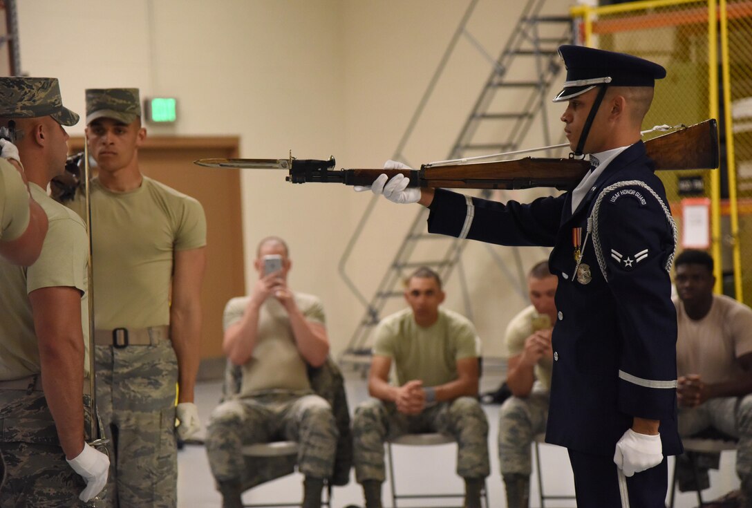 Airman 1st Class Jeremy De Leon, U.S. Air Force Honor Guard Drill Team member, performs a new routine during an evaluation at the Roberts Consolidated Aircraft Maintenance Facility Feb. 14, 2017, on Keesler Air Force Base, Miss. The team comes to Keesler every year for five weeks to develop a new routine, which is then revealed during an 81st Training Group drill down competition. The team preforms the routine used throughout the year. (U.S. Air Force photo by Kemberly Groue)