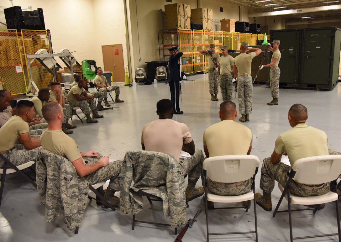Airmen from the U.S. Air Force Honor Guard Drill Team practices a new routine at the Roberts Consolidated Aircraft Maintenance Facility Feb. 26, 2016, on Keesler Air Force Base, Miss. The team comes to Keesler every year for five weeks to develop a new routine, which is then revealed during an 81st Training Group drill down competition. The team preforms the routine used throughout the year. (U.S. Air Force photo by Kemberly Groue)