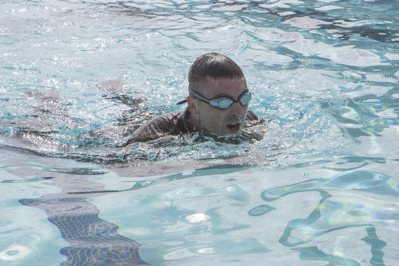 A Marine with Headquarters and Headquarters Squadron participates in a 200 meter individual swim at the combat training tank during the Grizzly Challenge at Marine Corps Air Station Miramar, Calif., Feb. 14. The challenge is held quarterly to bring the Marines in the unit together for team building. (U.S. Marine Corps photo by Lance Cpl. Liah Kitchen/Released)