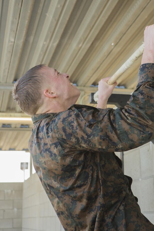 A Marine with Headquarters and Headquarters Squadron executes pull ups at the combat training tank during the Grizzly Challenge at Marine Corps Air Station Miramar, Calif., Feb. 14. The challenge is held quarterly to bring the Marines in the unit together for team building. (U.S. Marine Corps photo by Lance Cpl. Liah Kitchen/Released)