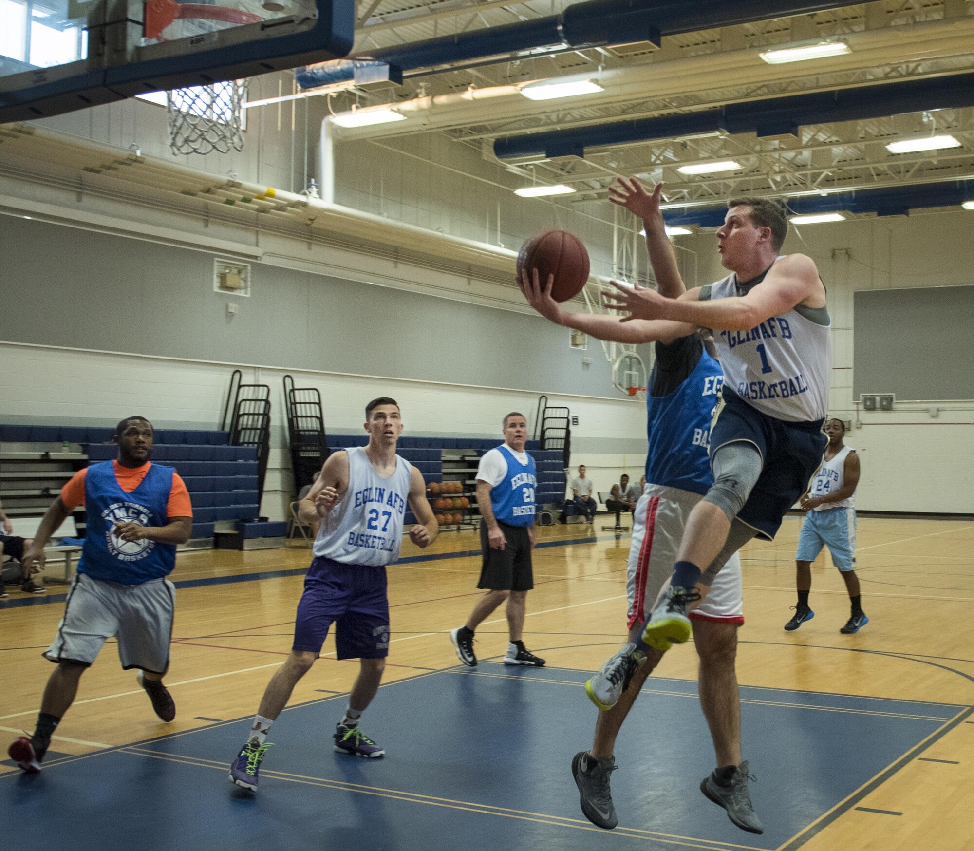 The 33rd Maintenance Squadron’s Sean Duval leaps toward the basket for a shot during his team’s intramural game against the Armament Directorate Feb. 16 at Eglin Air Force Base, Fla.  The Directorate team trailed for most of the game before dominating the last third in route to a 67-53 win.  (U.S. Air Force photo/Samuel King Jr.)