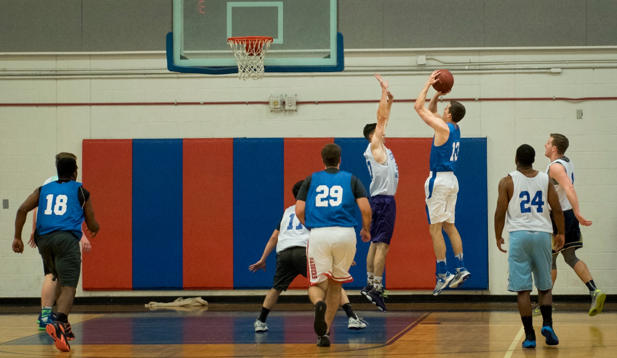 The Armament Directorate’s David Adler takes a shot during his team’s intramural game against the 33rd Maintenance Squadron Feb. 16 at Eglin Air Force Base, Fla.  The Directorate team trailed for most of the game before dominating the last third in route to a 67- 53 win.  (U.S. Air Force photo/Samuel King Jr.)