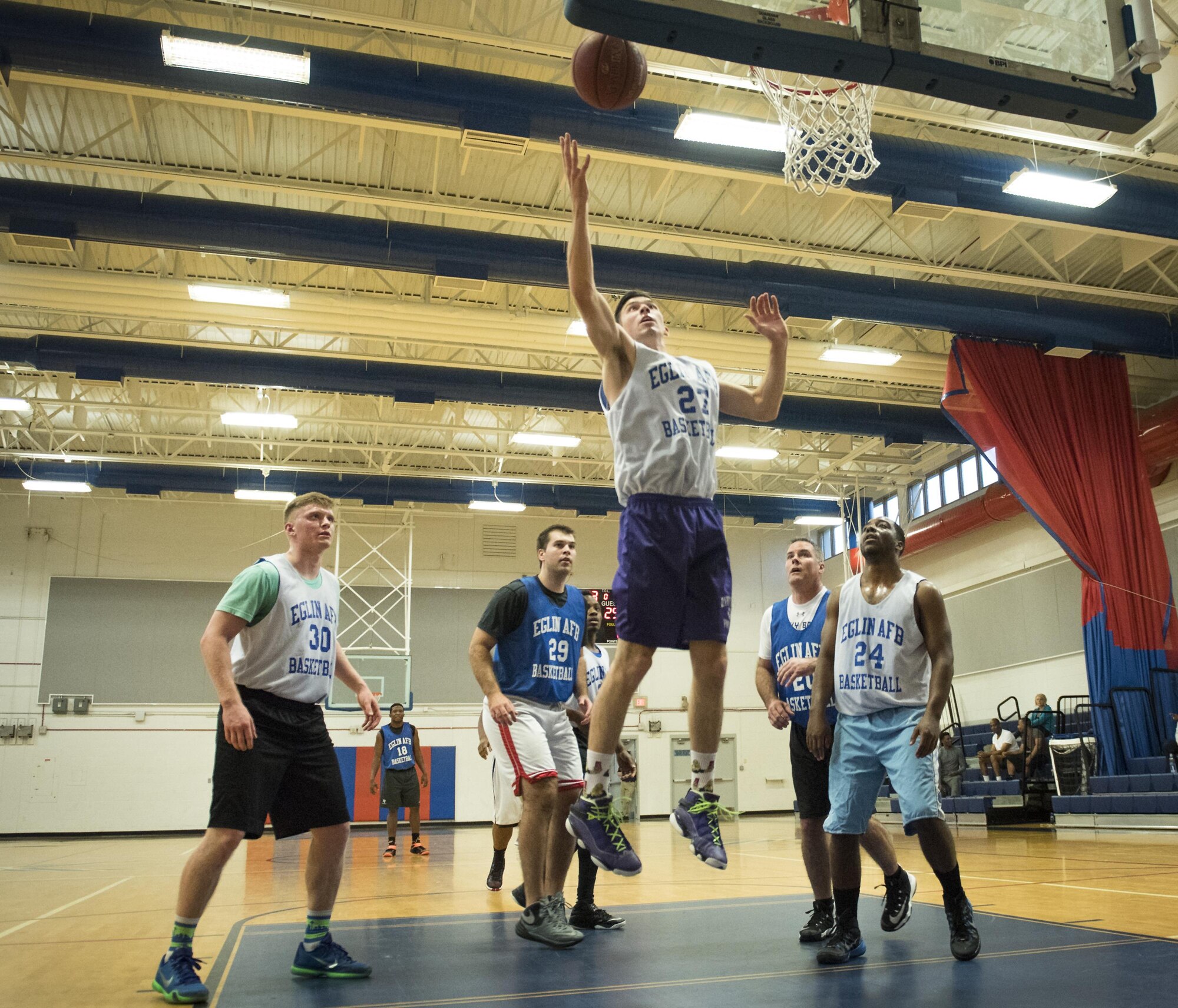 The 33rd Maintenance Squadron’s Derek Leuzinger grabs a rebound during his team’s intramural game against the Armament Directorate Feb. 16 at Eglin Air Force Base, Fla.  The Directorate team trailed for most of the game before dominating the last third in route to a 67-53 win.  (U.S. Air Force photo/Samuel King Jr.)