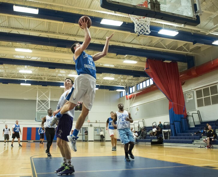 The Armament Directorate’s David Adler drives the lane for a layup during his team’s intramural game against the 33rd Maintenance Squadron Feb. 16 at Eglin Air Force Base, Fla.  The Directorate team trailed for most of the game before dominating the last third in route to a 67- 53 win.  (U.S. Air Force photo/Samuel King Jr.)