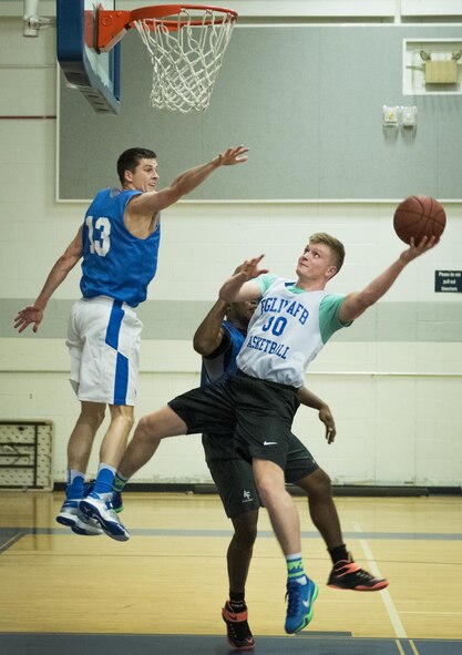The 33rd Maintenance Squadron’s Nathan Sheldon leaps toward the basket for a shot during his team’s intramural game against the Armament Directorate Feb. 16 at Eglin Air Force Base, Fla.  The Directorate team trailed for most of the game before dominating the last third in route to a 67-53 win.  (U.S. Air Force photo/Samuel King Jr.)