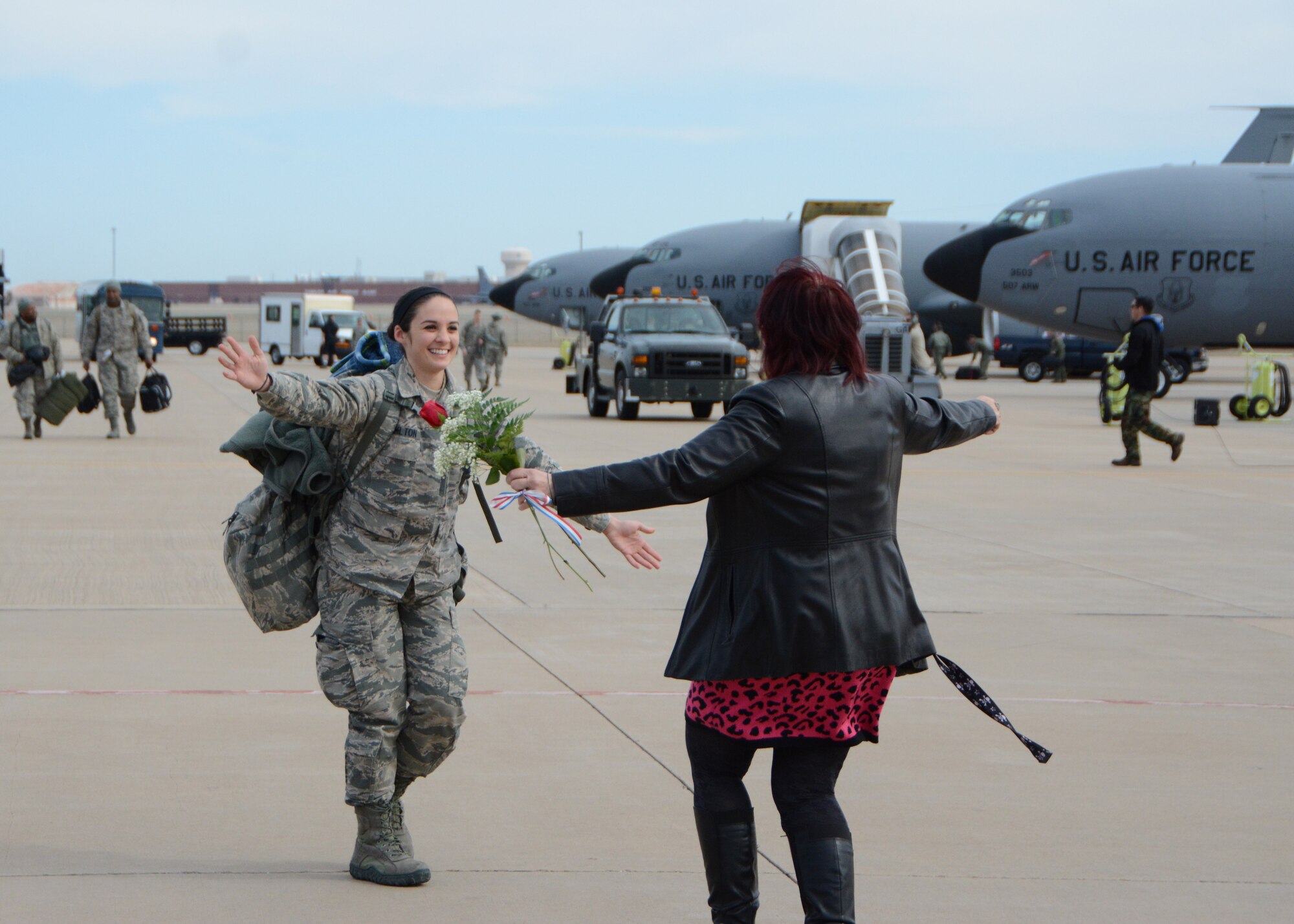 Senior Airman Nathalie Hamilton, a crew chief with the 507th Aircraft Maintenance Squadron, opens her arms to hug her mother following a deployment Feb. 17, 2017, at Tinker Air Force Base, Okla. More than 90 Reservists deployed in December 2016 in support of air operations at Incirlik Air Base, Turkey, against the Islamic State group. (U.S. Air Force photo/Tech. Sgt. Lauren Gleason)