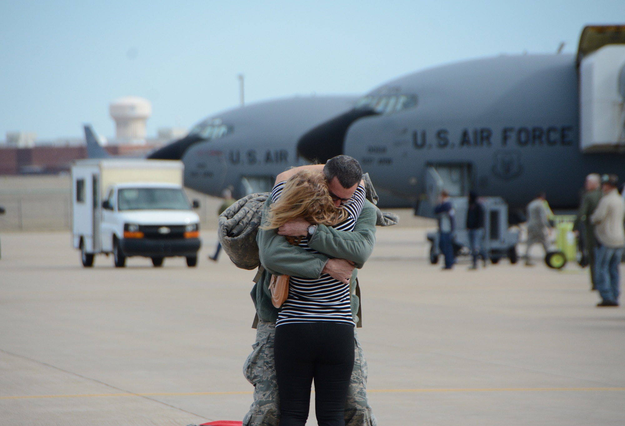Staff Sgt. Tim Hardy of the 507th Aircraft Maintenance Squadron hugs his wife following a deployment Feb. 17, 2017, at Tinker Air Force Base, Okla. More than 90 Reservists deployed in December 2016 in support of air operations at Incirlik Air Base, Turkey, against the Islamic State group. (U.S. Air Force photo/Tech. Sgt. Lauren Gleason)