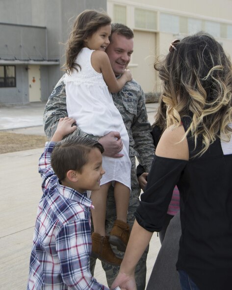 Tech. Sgt. Jonathan Brem of the 507th Maintenance Squadron reunites with his family following a deployment Feb. 17, 2017, at Tinker Air Force Base, Okla. More than 90 other Reservists deployed in December 2016 in support of air operations at Incirlik Air Base, Turkey, against the Islamic State group. (U.S. Air Force photo/Tech. Sgt. Lauren Gleason)