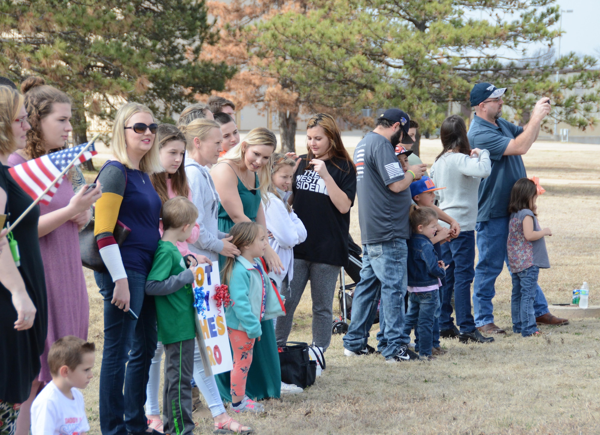 Friends and family members await the arrival of their Airmen following a deployment Feb. 19, 2017, at Tinker Air Force Base, Okla. More than 90 Reservists deployed in December 2016 in support of air operations at Incirlik Air Base, Turkey, against the Islamic State group. (U.S. Air Force photo/Tech. Sgt. Lauren Gleason)