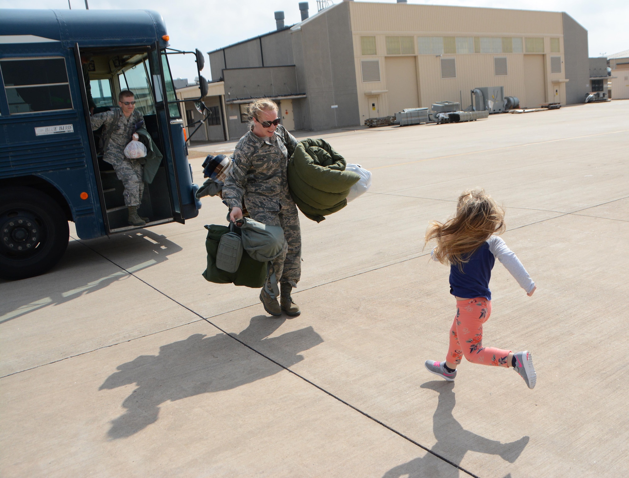 Staff Sgt. Morgan Marriott of the 507th Maintenance Squadron opens her arms to greet her daughter following a deployment Feb. 19, 2017, at Tinker Air Force Base, Okla. More than 90 Reservists deployed in December 2016 in support of air operations at Incirlik Air Base, Turkey, against the Islamic State group. (U.S. Air Force photo/Tech. Sgt. Lauren Gleason)
