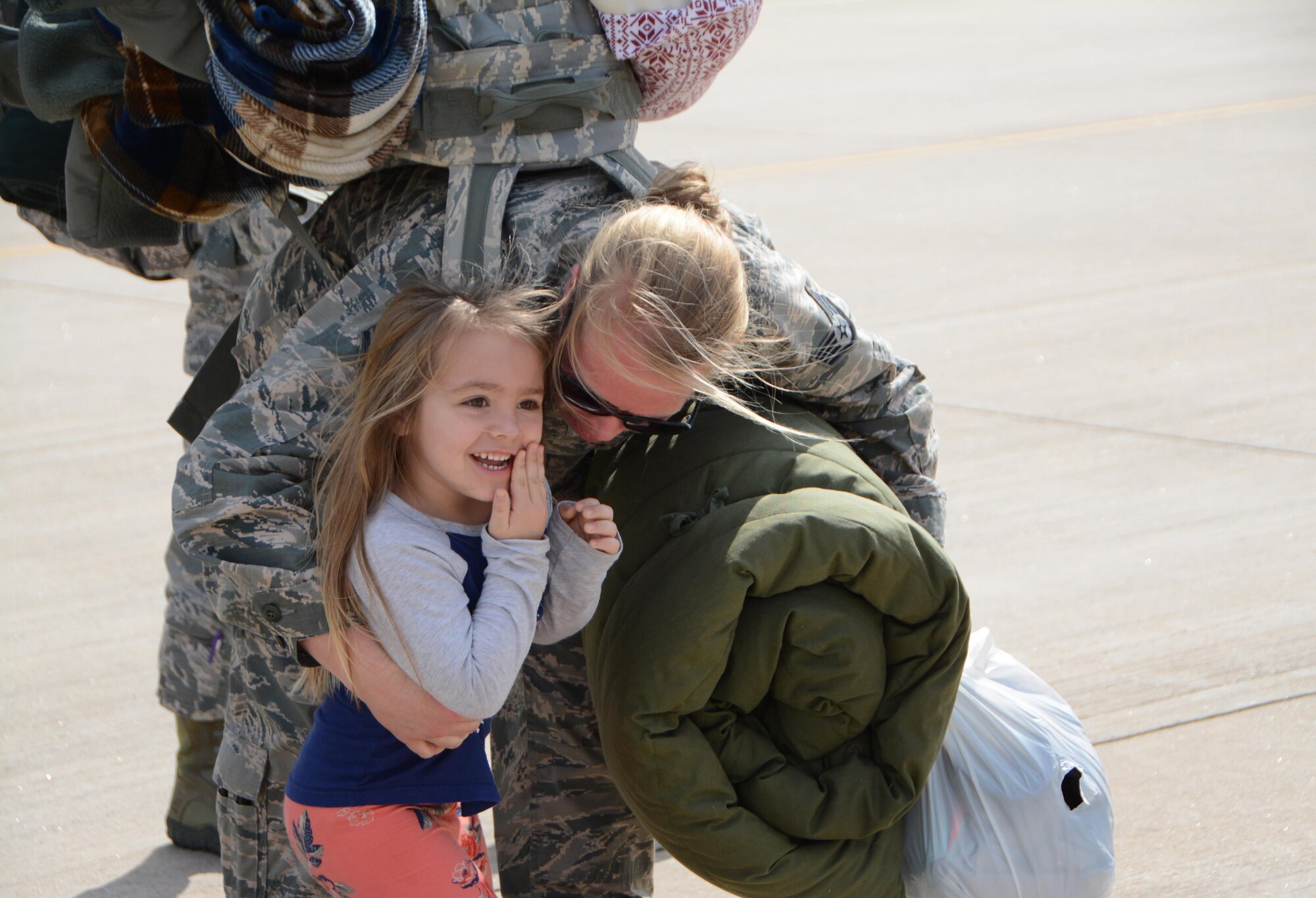 Staff Sgt. Morgan Marriott of the 507th Maintenance Squadron hugs her daughter following a deployment Feb. 19, 2017, at Tinker Air Force Base, Okla. More than 90 Reservists deployed in December 2016 in support of air operations at Incirlik Air Base, Turkey, against the Islamic State group. (U.S. Air Force photo/Tech. Sgt. Lauren Gleason)