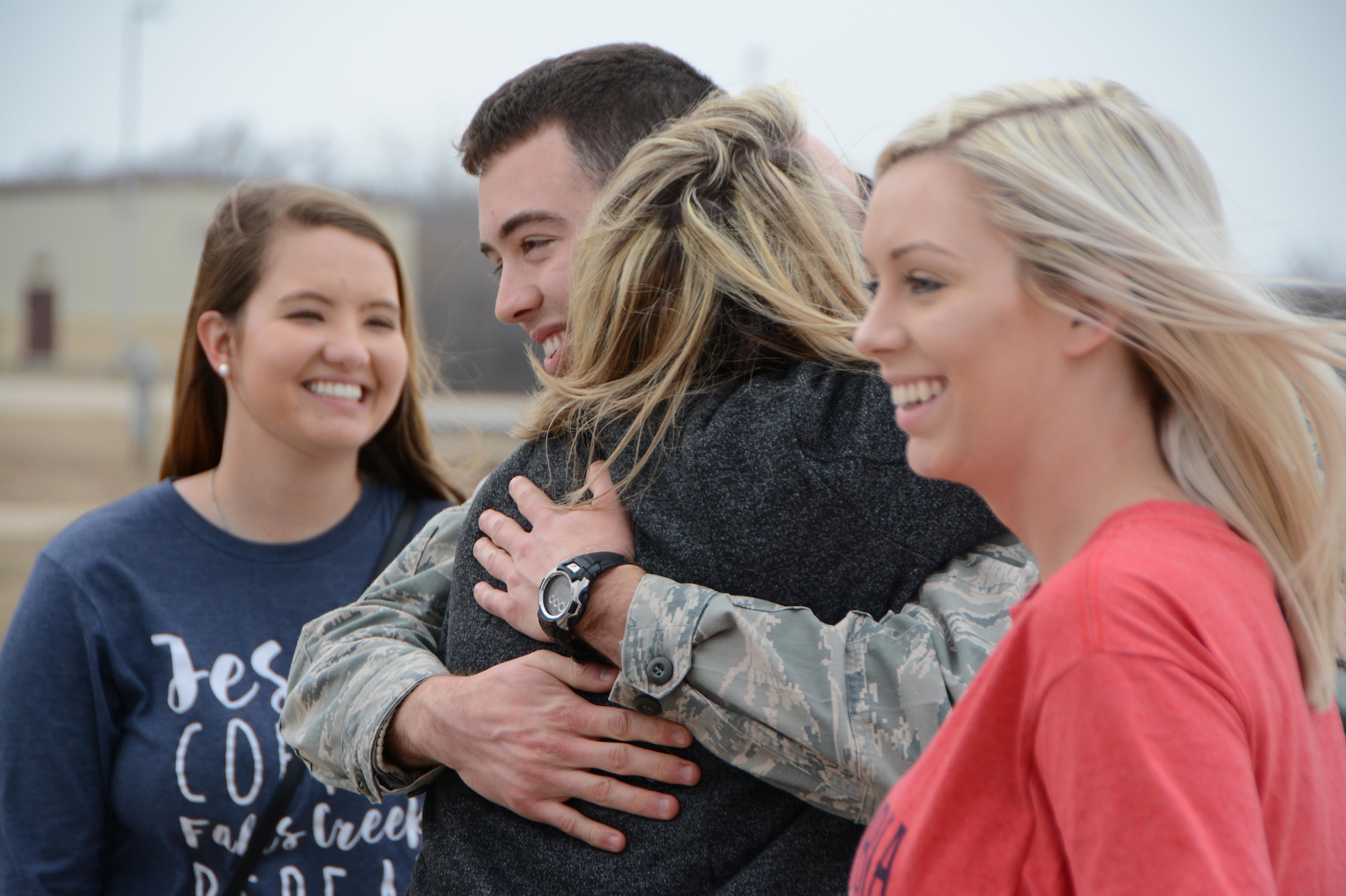 Senior Airman Tyler Franz of the 507th Operations Support Squadron hugs his family members following a deployment Feb. 19, 2017, at Tinker Air Force Base, Okla. Franz was awarded the 507th Air Refueling Wing Airman of the Year award for 2016 while he was deployed. More than 90 Reservists deployed in December 2016 in support of air operations at Incirlik Air Base, Turkey, against the Islamic State group. (U.S. Air Force photo/Tech. Sgt. Lauren Gleason)