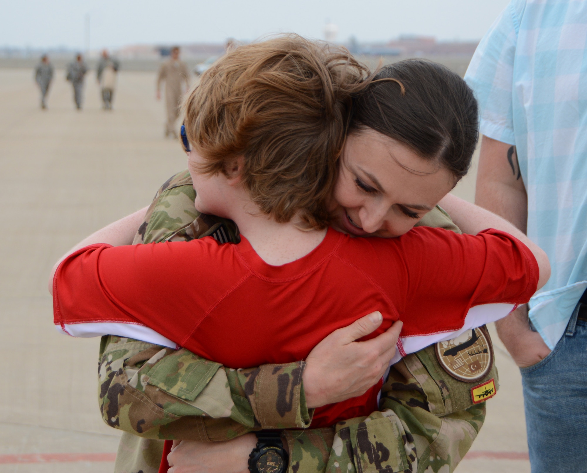 Senior Airman Brandy Hill of the 465th Air Refueling Squadron hugs her son Lukas following a deployment Feb. 19, 2017, at Tinker Air Force Base, Okla. More than 90 Reservists deployed in December 2016 in support of air operations at Incirlik Air Base, Turkey, against the Islamic State group. (U.S. Air Force photo/Tech. Sgt. Lauren Gleason)